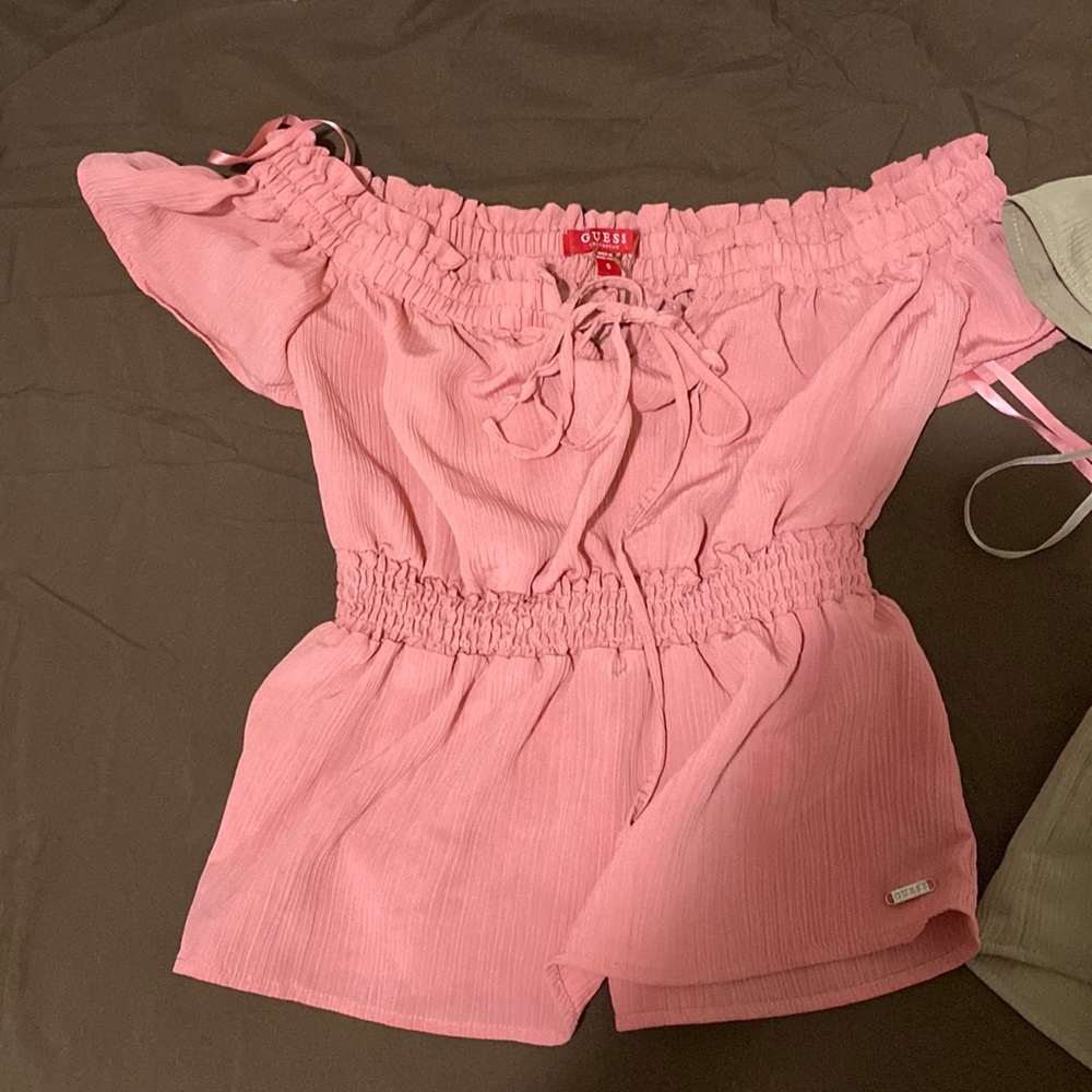 Super cute shirts by guess. (2 pack) Was a gift and they are too small for me